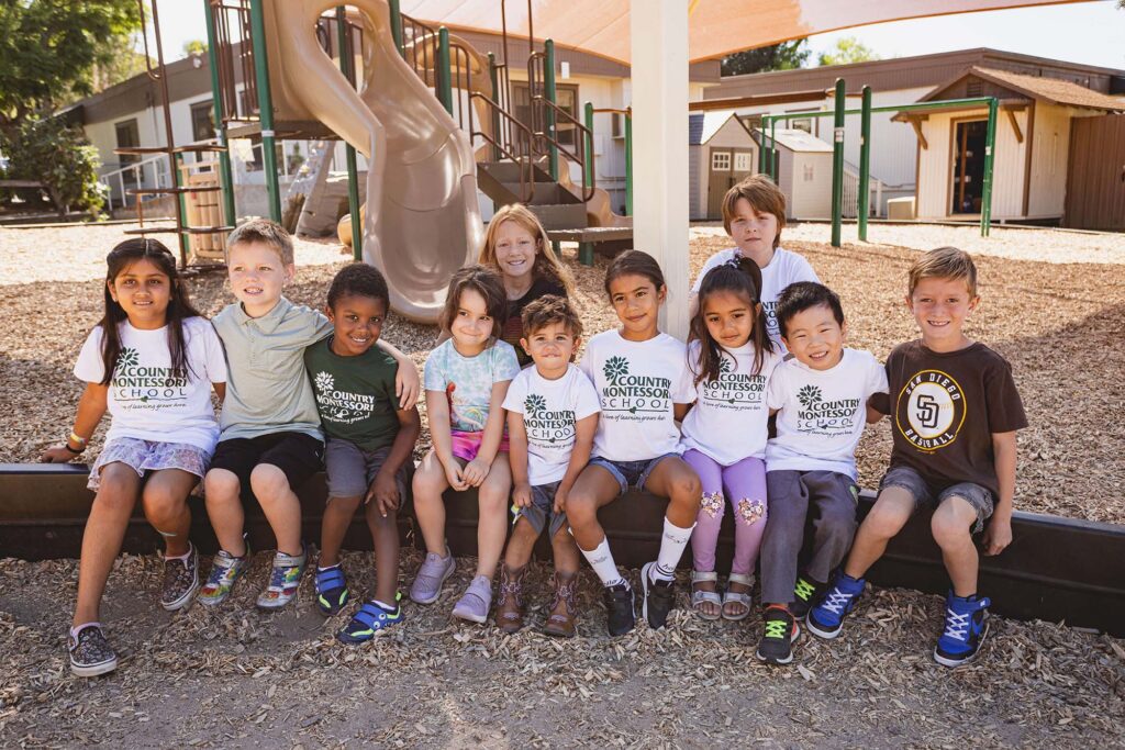 Smiling students together on the playground at Country Montessori School in Poway